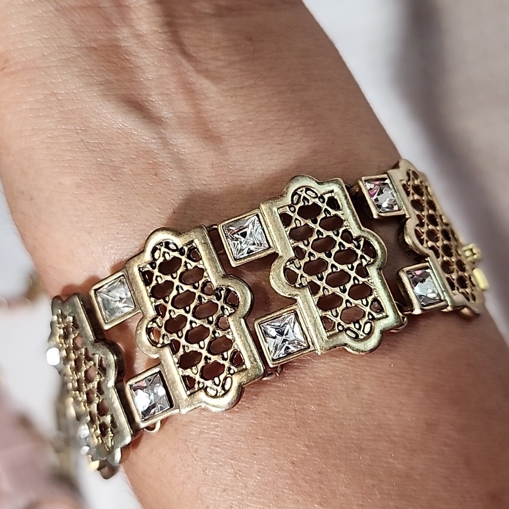 KF Gold Tone Bracelet with Textured Design and Crystals
